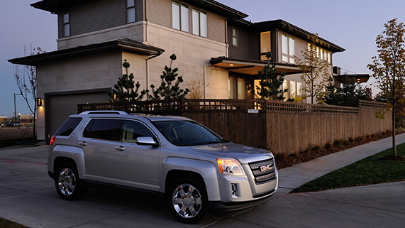 Car in front of a nice house | Earnhardt Buick GMC in MESA AZ